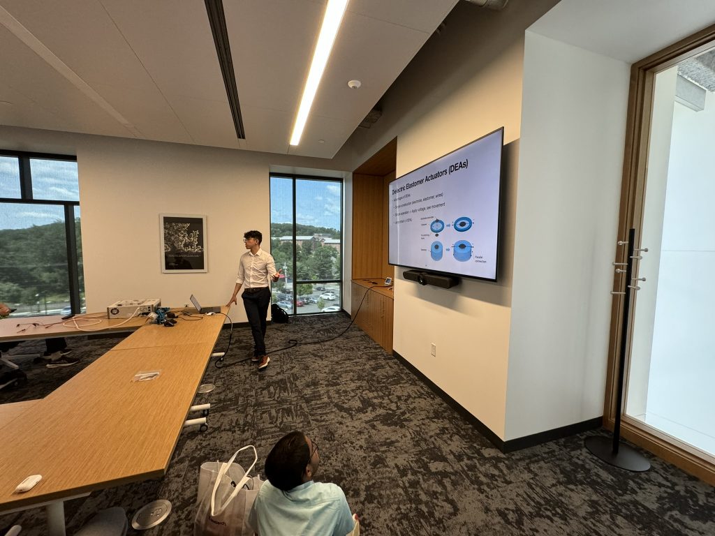 Lab alumni, Dom Flores, presents to students about Pneumatic Network Actuators (PneuNets).