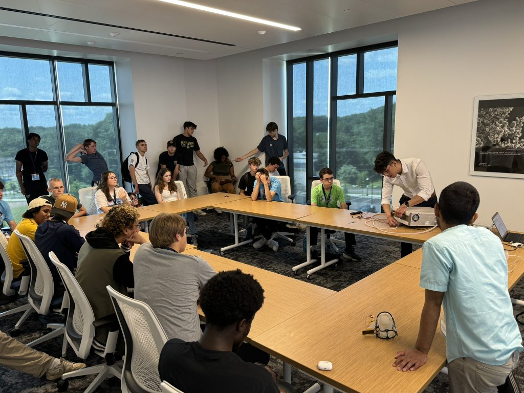 Lab alumni, Dom Flores, presents to students about the power electronics of soft robotic actuators.