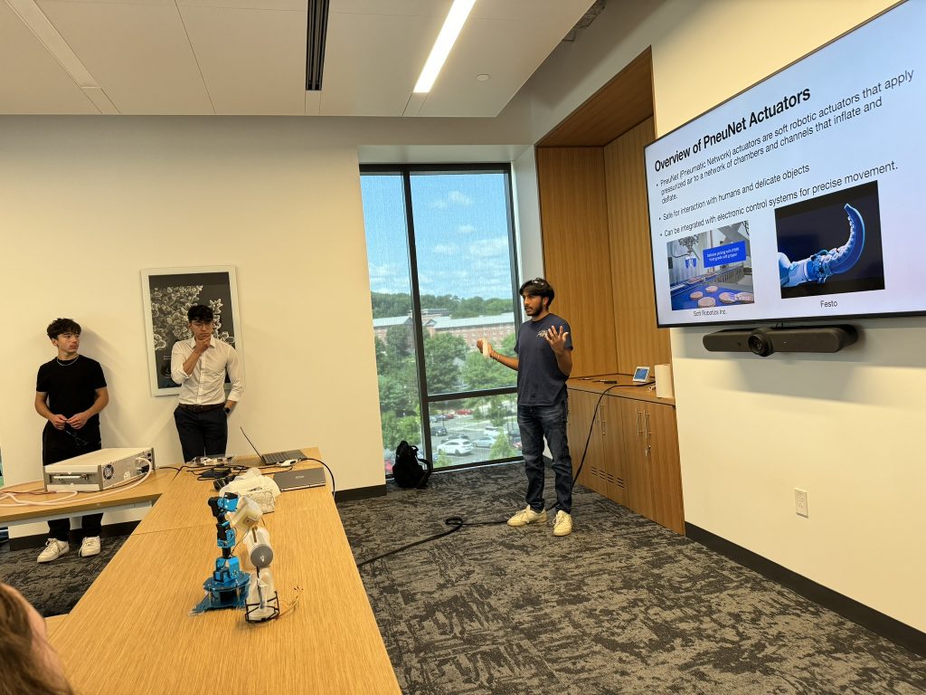 Lab alumni, Sahib Sandhu, presents to students about soft robotic actuators.