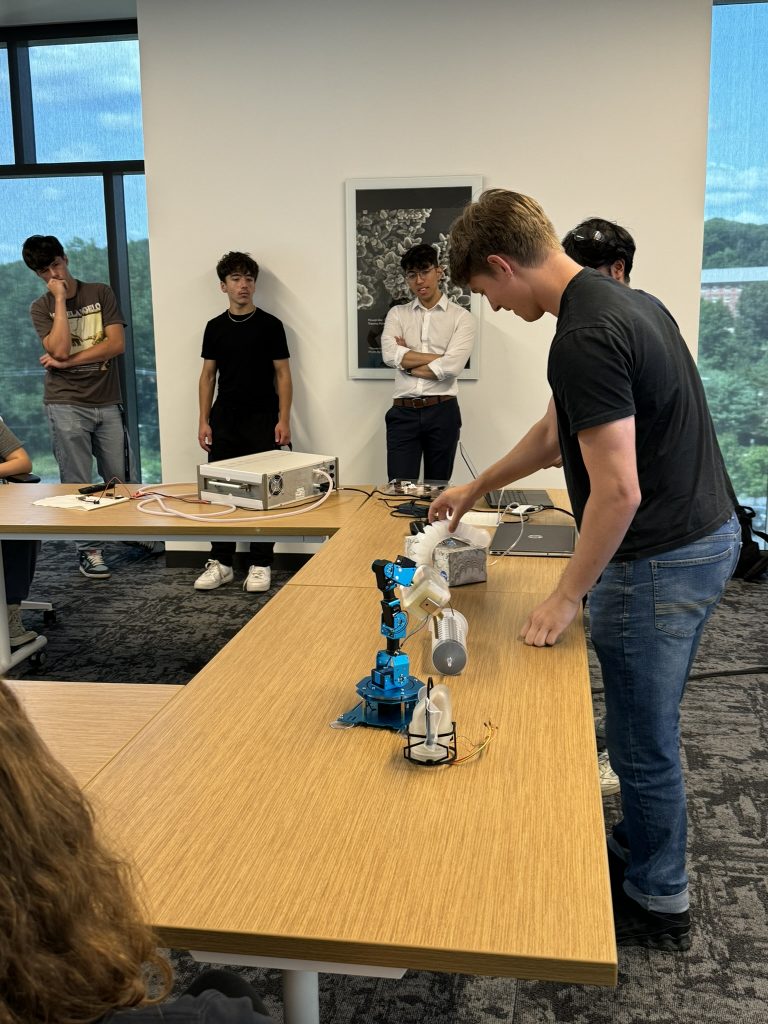 Lab alumni, Sahib Sandhu, and current PhD student, Alex White, present to students about soft robotic actuators.