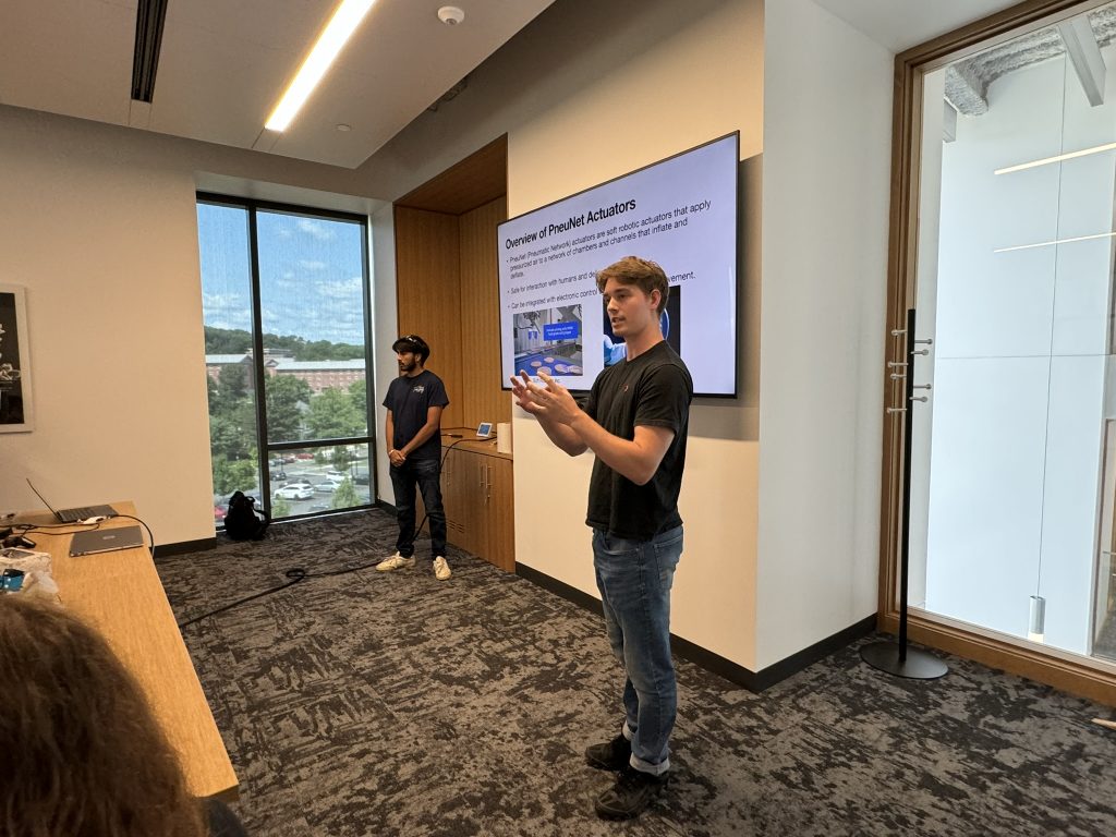 Lab alumni, Sahib Sandhu, and current PhD student, Alex White, present to students about soft robotic actuators.